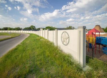 retaining wall by playground near IH-635