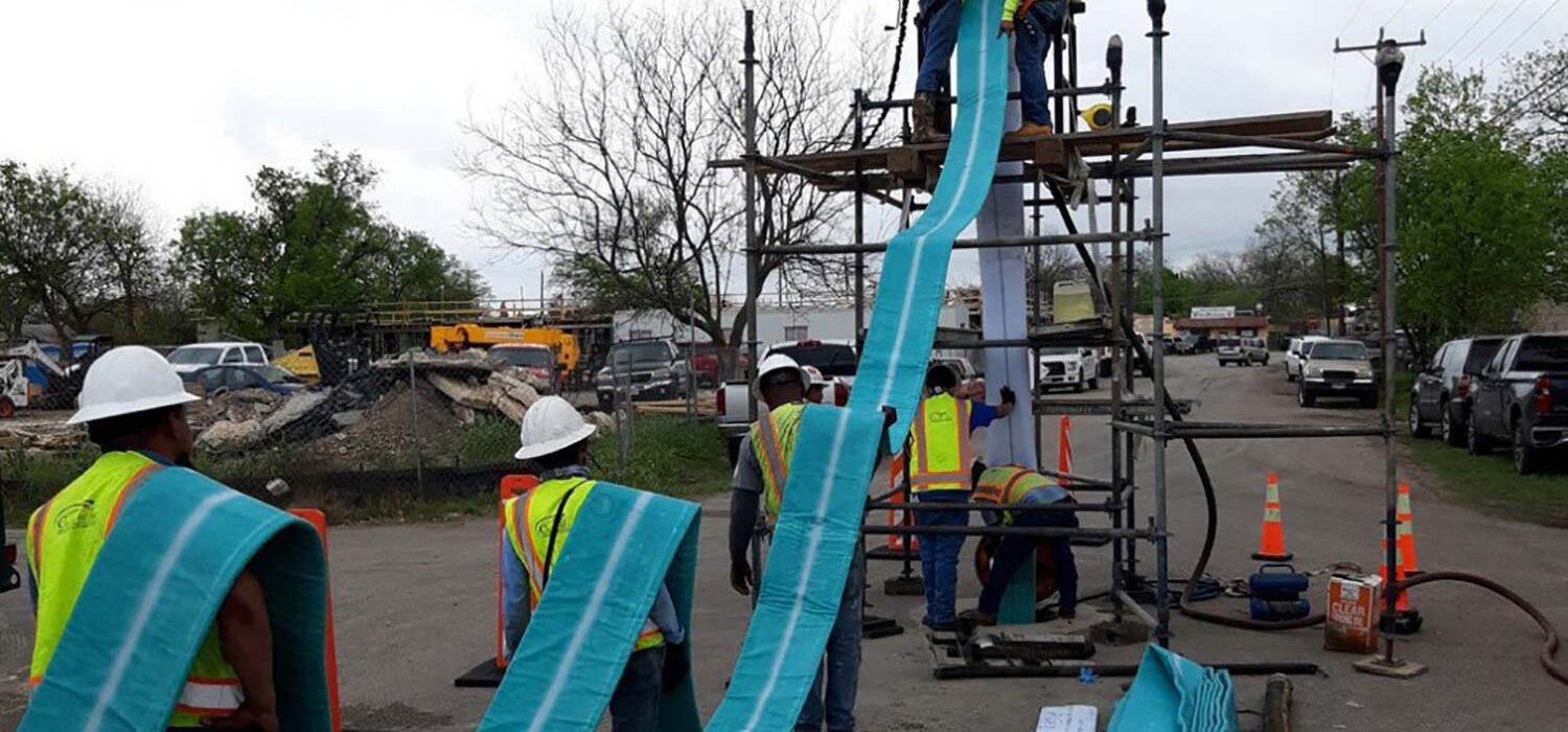 crew workers installing sewershed package